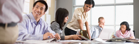 people working around a conference table