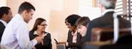 group gathered around conference table