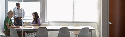 three people at conference table