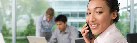 woman on the phone in busy office